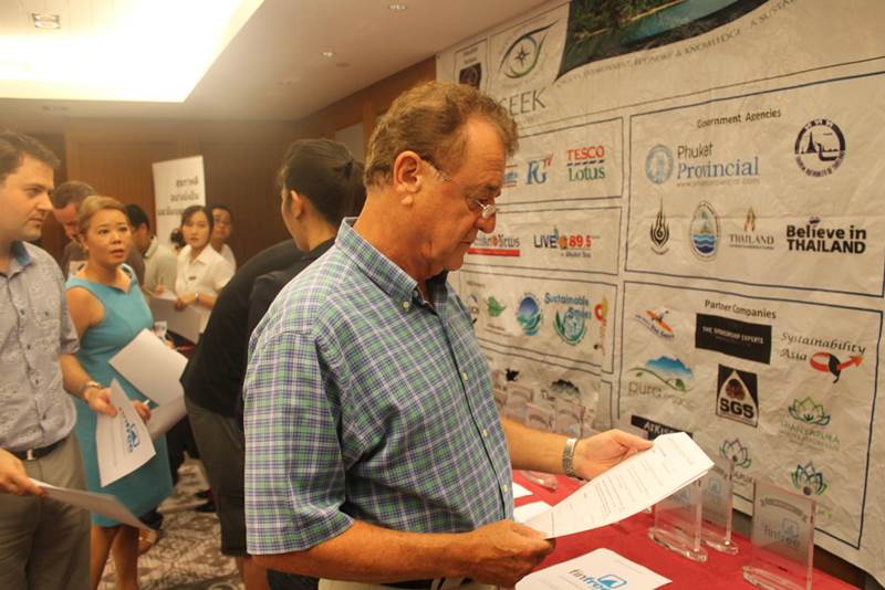 A hotel GM examines the details of the campiagn before signing.