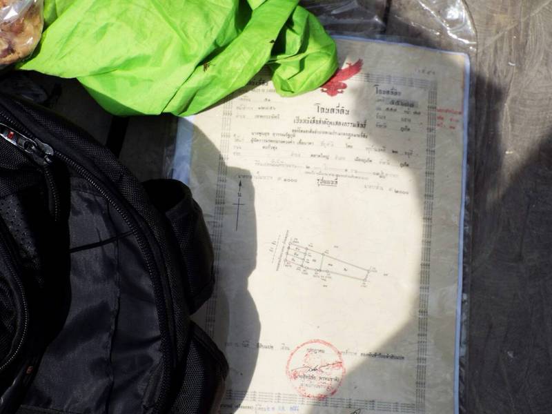 The bag contained a Chanote title deed for a plot of land at Baan Prusomphan in Tambon Thepkrasattri, Thalang, where Mr Chalermphol was registered as living. Photo: Eakkapop Thongtub