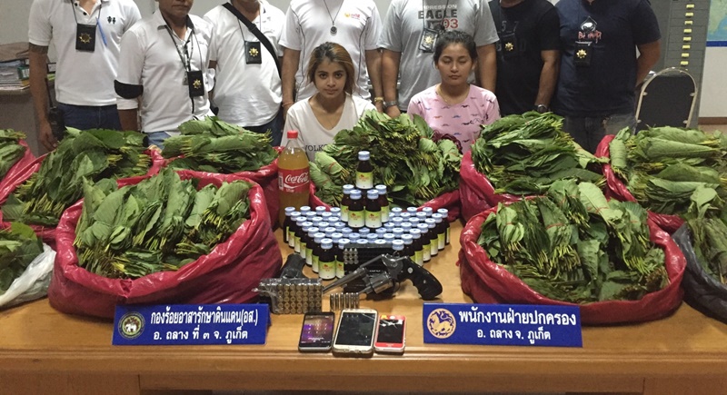 Ms Wasinee Isolbusor, 24, and Ms Jutharat Jitnaree, 18, were arrested with 1.25 litres of kratom juice, one unregistered .38 mm Smith & Wesson pistol, 15 .38mm bullets, 41 .45mm bullets, 857 bundle of fresh kratom leaves weighing a total of 43.3 kilos, 62 bottles of cough syrup and other items. Photo: Darawan Naknakhon