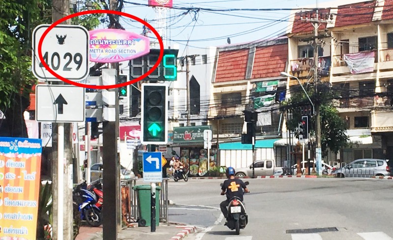 The only sign in English (in red circle) is at the road’s northern junction with Phra Baramee Rd, and is not even official.  Photo: Patong Municipality