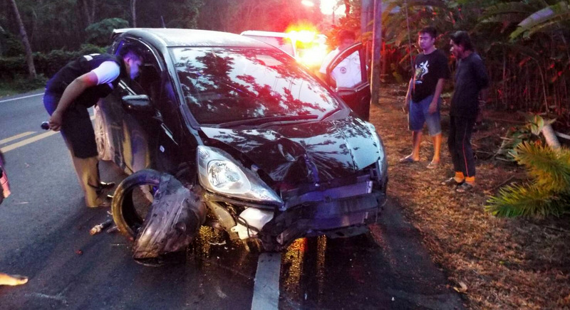 Police and Kusoldharm Foundation rescue workers arrived to find a Phuket-registered black Honda Jazz askew in the middle of the road. Photo: Eakkapop Thongtub