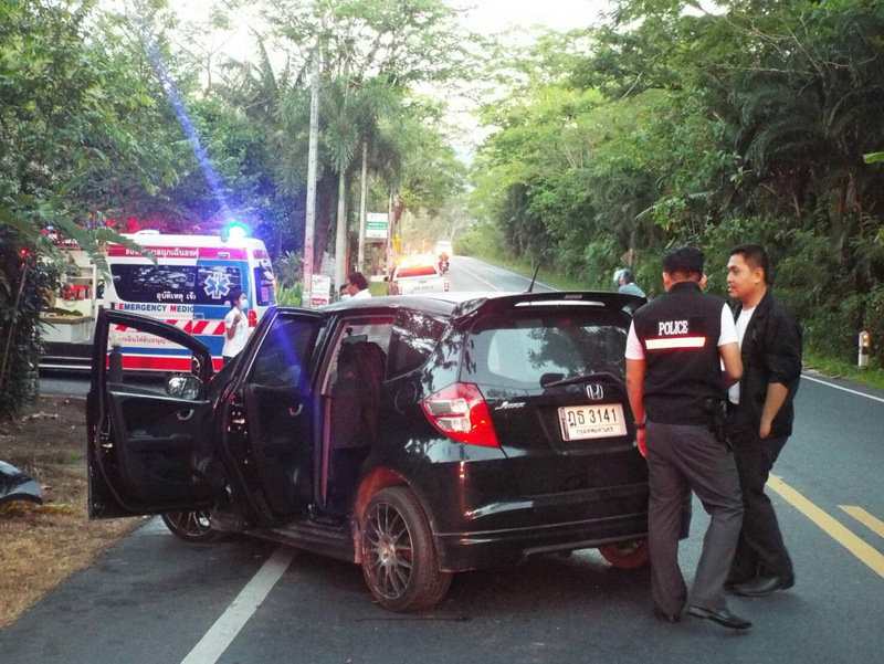 Police and Kusoldharm Foundation rescue workers arrived to find a Phuket-registered black Honda Jazz askew in the middle of the road. Photo: Eakkapop Thongtub
