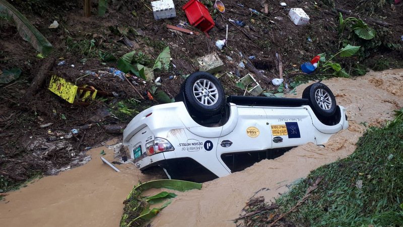 Phuket landslide lands Fortuner taxi in canal