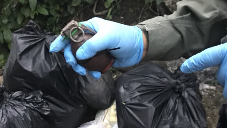 Live grenade found dumped in roadside rubbish