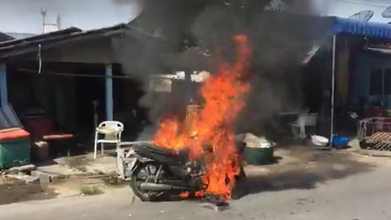Woman escapes injury as motorbike explodes into flames