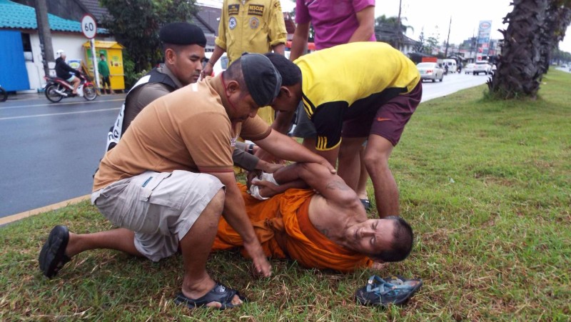 Monk prevented from walking into Phuket traffic