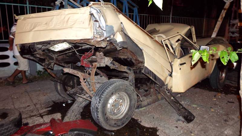 New pickup smashes parked cars and power pole