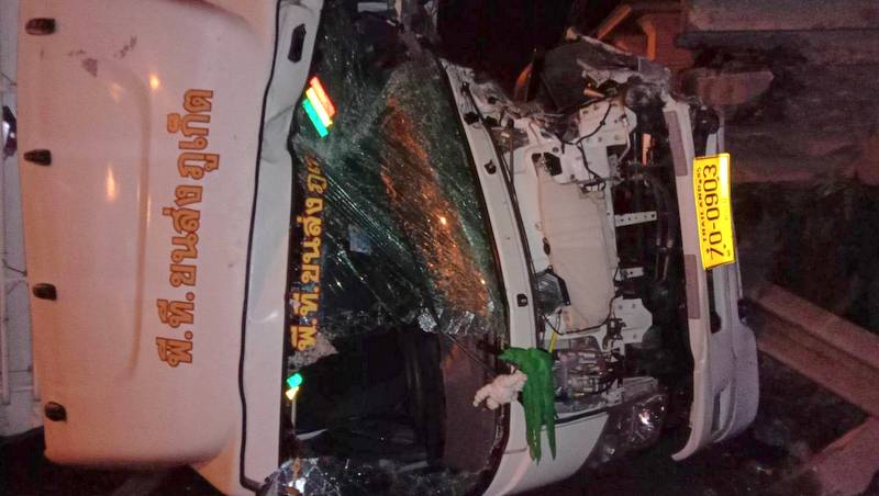 Driver charged, blames wet road for truck slamming into footbridge