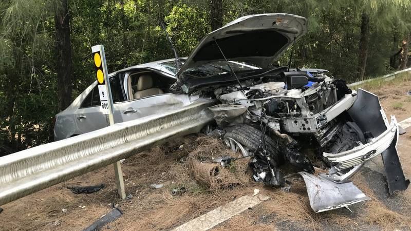 Driver escapes with just scratches as wipeout leaves car embedded in guardrail