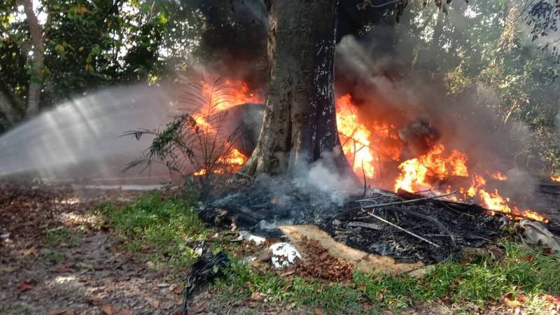 Speedboat destroyed as garbage pile fire spreads near homes