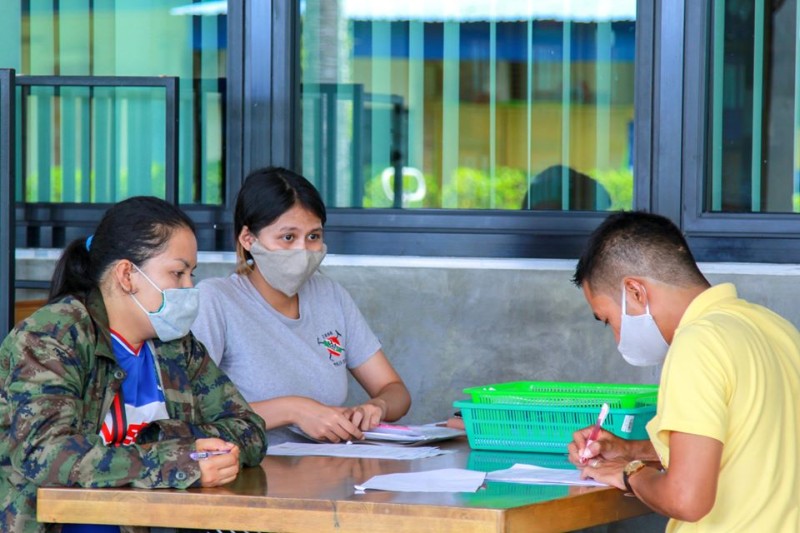 Parents register to receive milk powder in Patong. Photo: Patong Municipality