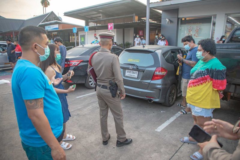 Holiday travellers find human body trapped under their car