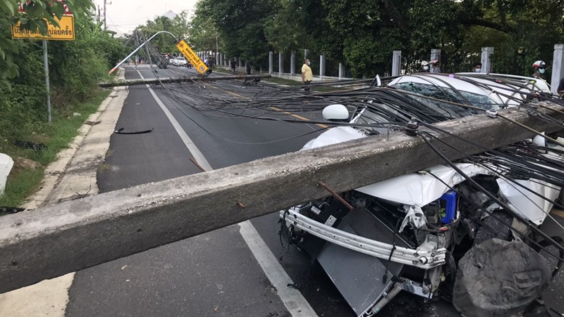 Narrow escape for motorbike rider as car hits power pole, brings down high-voltage lines