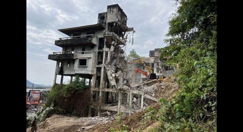 Demolition of bypass hotel on track