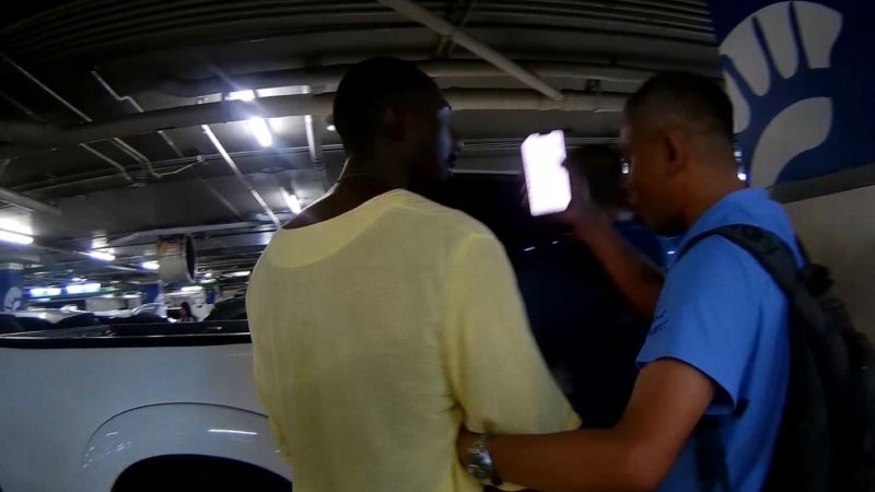American man arrested for assault, theft