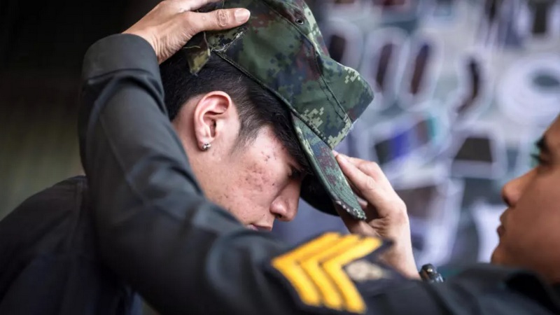 Red or black: Thai men tempt fate at military draft draw